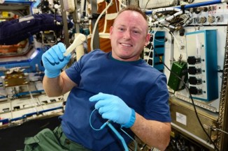 Commander Barry Wilmore with the 3D-printed wrench. (photo courtesy of NASA)